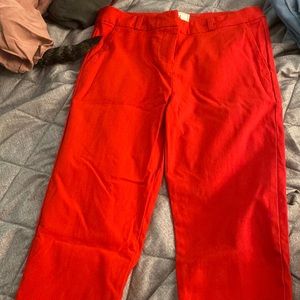 High waisted red rayon skinny leg pants. Size small. Never worn. Brand new
